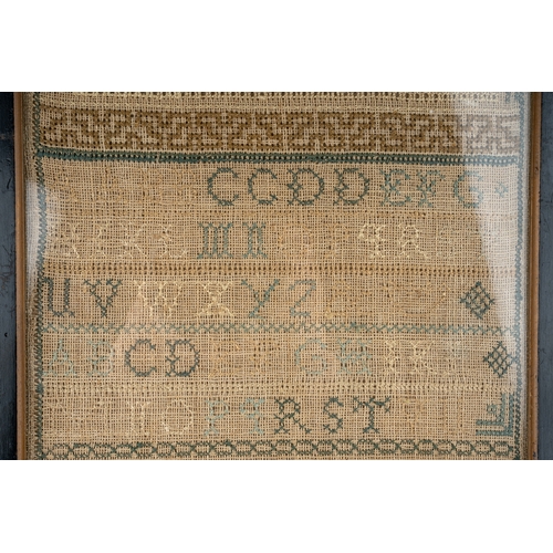 680 - A 19th century silk on linen needlework sampler by Sarah Quartly - dated 1833.  Embroidered at the E... 