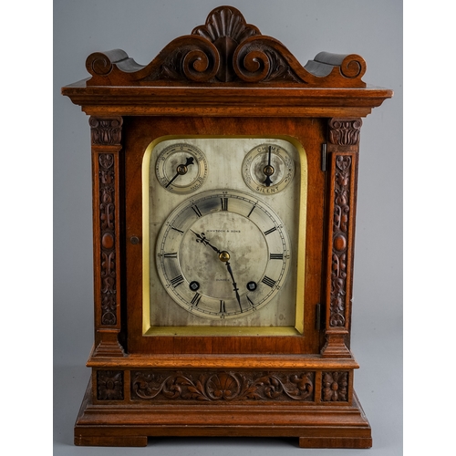 686 - An early 20th Century mahogany cased mantle 8 day clock, the silvered dial with Roman numerals, two ... 