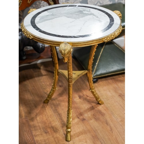 690 - An Italian/French ormolu and marble circular centre table, on three supports with Ram's head termina... 