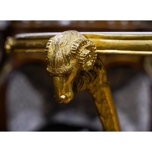 690 - An Italian/French ormolu and marble circular centre table, on three supports with Ram's head termina... 