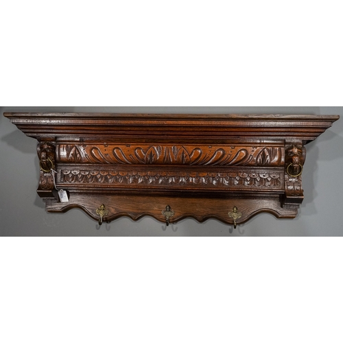 693 - An Edwardian carved oak overmantel style wall hanging applied with brass coat hooks, approx 93cm wid... 