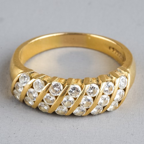 107 - An 18ct yellow gold and diamond ring, set with seven rows of three round brilliant-cut diamonds, est... 