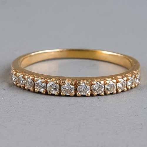 108 - A yellow gold and diamond half eternity ring, set with twelve round brilliant-cut diamonds approx 0.... 