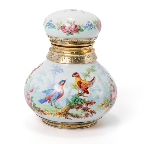 563 - A late 19th/ early 20th century continental porcelain scent bottle, enameled with fanciful birds and... 