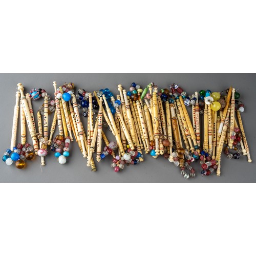 681 - Collection of approximately 58 named Victorian carved bone lace bobbins, many with glass spangles.