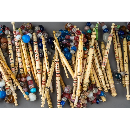 681 - Collection of approximately 58 named Victorian carved bone lace bobbins, many with glass spangles.