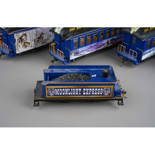 261 - A Hawthorne Village Bachmann Silver Moon Express electric train set comprising locomotive, tender & ... 