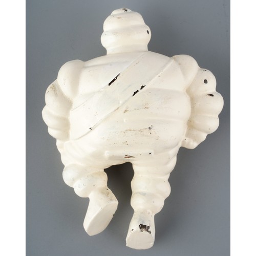 322 - A vintage cast Michelin man, seated wearing Michelin sash, approx 11.5cm long