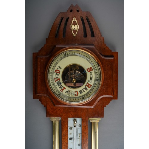 687 - An Arts and Crafts style brass mounted barometer, approx 54cm long