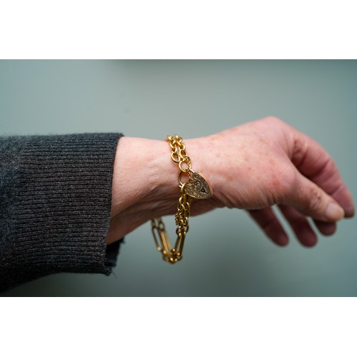 39 - An 18ct yellow gold bracelet, converted from a watch chain, with a 9ct gold padlock clasp, total gro... 