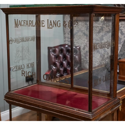 695 - A late Victorian/ early 20th Century mahogany framed shop display cabinet for 