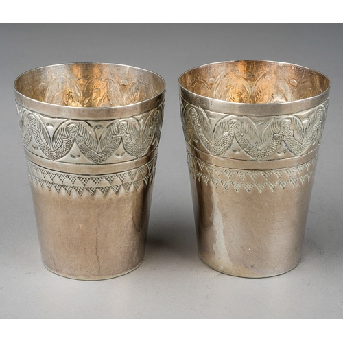 18 - A pair of Continental white metal probably 800 standard silver tots / beakers, approx weight 49.2 gr... 