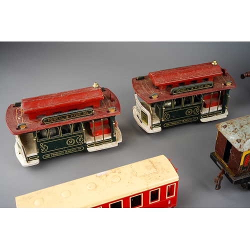 33 - A collection of English vintage tin plate toys to include: Mettoy type clockwork tractor (mechanism ... 