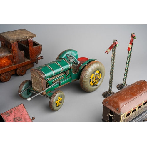 33 - A collection of English vintage tin plate toys to include: Mettoy type clockwork tractor (mechanism ... 