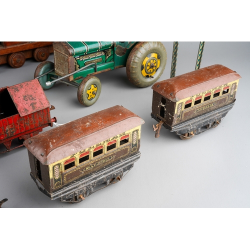 33 - A collection of English vintage tin plate toys to include: Mettoy type clockwork tractor (mechanism ... 