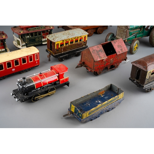 33 - A collection of English vintage tin plate toys to include: Mettoy type clockwork tractor (mechanism ... 