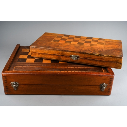 34 - Two vintage vari wood game boards with wooden draught pieces, the larger board with interior baize b... 