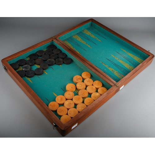 34 - Two vintage vari wood game boards with wooden draught pieces, the larger board with interior baize b... 