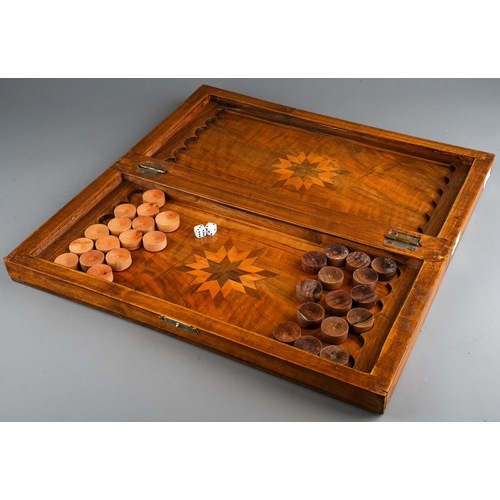 34 - Two vintage vari wood game boards with wooden draught pieces, the larger board with interior baize b... 