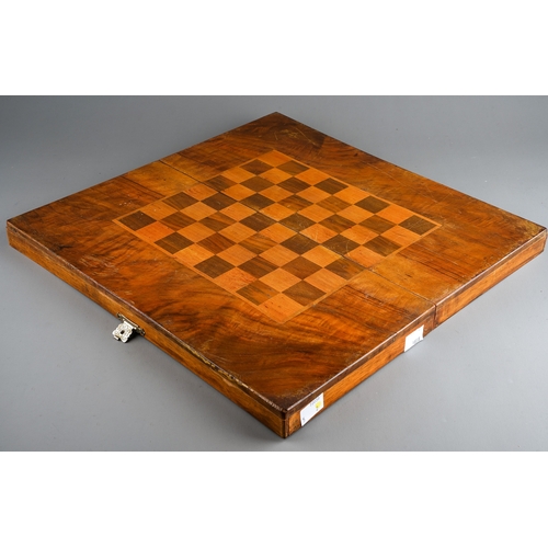 34 - Two vintage vari wood game boards with wooden draught pieces, the larger board with interior baize b... 