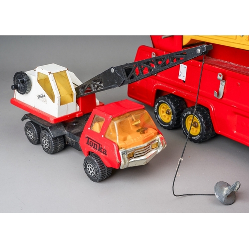 36 - Tonka Toys.  A large scale 1980's fire truck, missing side ladders and a red/white recovery crane 19... 