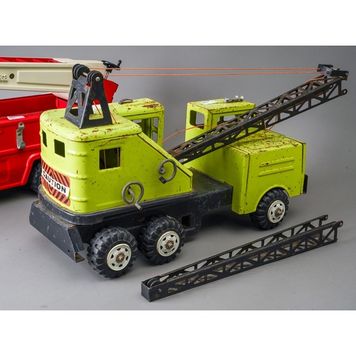 43 - Tonka Toys.  A large scale fire engine missing one ladder with a green Power House Earthmovers crane... 