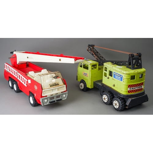 43 - Tonka Toys.  A large scale fire engine missing one ladder with a green Power House Earthmovers crane... 