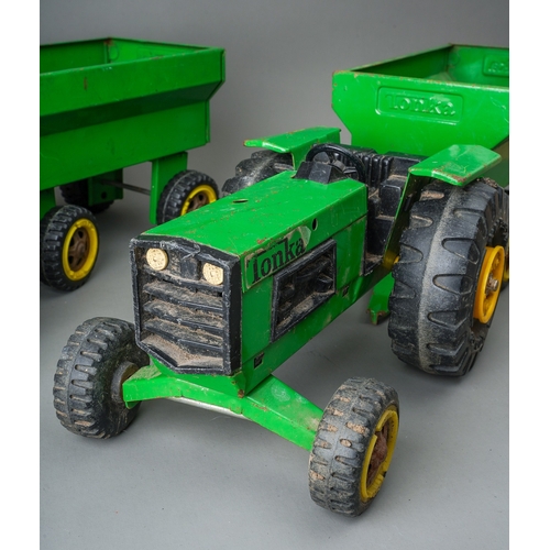 44 - Tonka Toys.  A pair of large scale green tractors with matching trailers