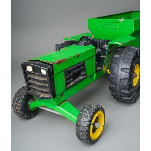 44 - Tonka Toys.  A pair of large scale green tractors with matching trailers