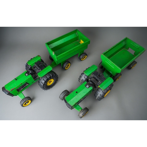 44 - Tonka Toys.  A pair of large scale green tractors with matching trailers