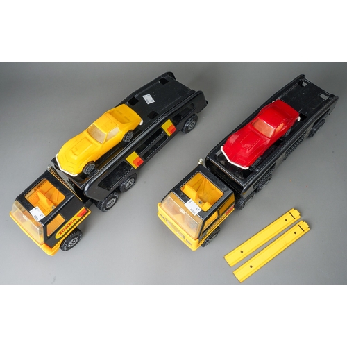 47 - Tonka Toys.  A pair of black/yellow articulated car transporters, one complete with 2 plastic cars. ... 