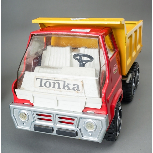 48 - Tonka Toys. A red/yellow 6 wheel tipper truck together with a green plastic bodied 6 wheel refuse tr... 