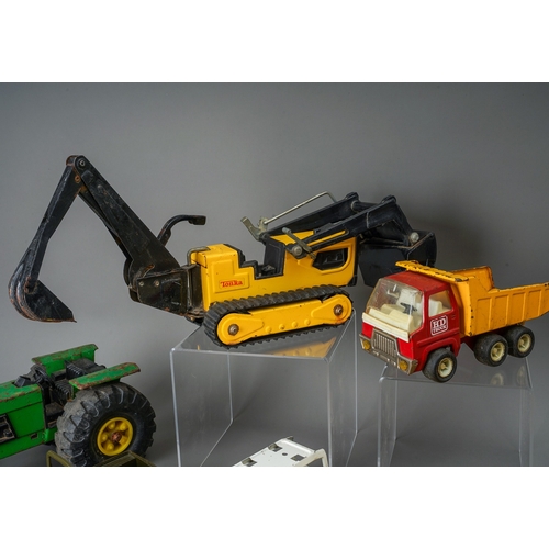 49 - Tonka Toys.  Two trays of play worn vehicles to include 6 small scale bulldozers and 8 articulated t... 