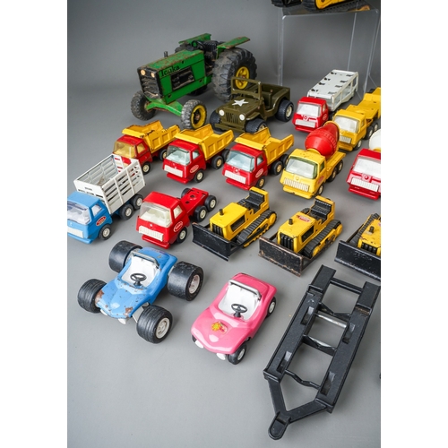 49 - Tonka Toys.  Two trays of play worn vehicles to include 6 small scale bulldozers and 8 articulated t... 