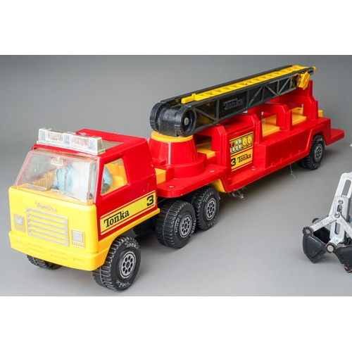 51 - Tonka Toys.  A red/yellow plastic bodied articulated fire truck together with a medium size 6 wheel ... 