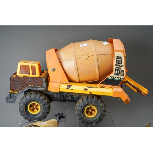 55 - Tonka Toys.  Four large scale vehicles - tractor, fire engine, dump truck and cement mixer, all requ... 