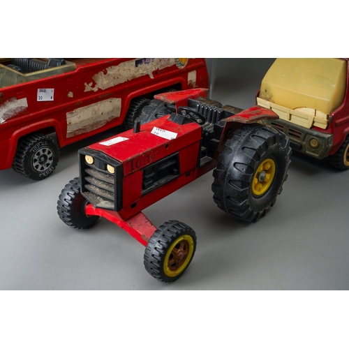 55 - Tonka Toys.  Four large scale vehicles - tractor, fire engine, dump truck and cement mixer, all requ... 