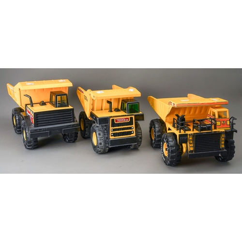 57 - Tonka Toys.  Three large scale dump trucks, all of differing designs (3)