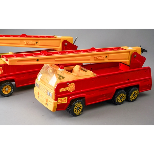 58 - Tonka Toys.  Two large scale 6 wheel fire engines, red with yellow fittings, red with white fittings... 