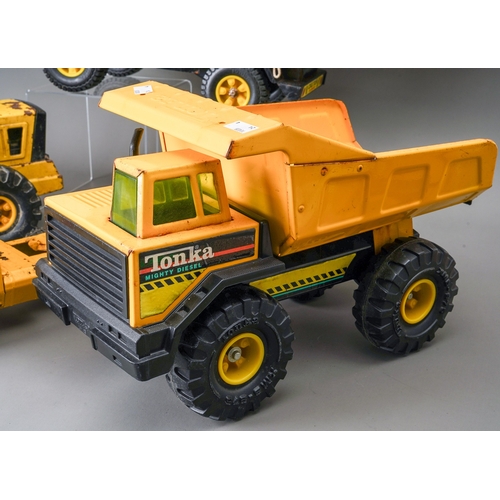 59 - Tonka Toys.  Four large scale vehicles - car carrier, loader, 4 wheel crane, dump truck, all requiri... 