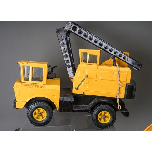 59 - Tonka Toys.  Four large scale vehicles - car carrier, loader, 4 wheel crane, dump truck, all requiri... 