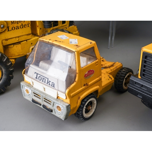 59 - Tonka Toys.  Four large scale vehicles - car carrier, loader, 4 wheel crane, dump truck, all requiri... 