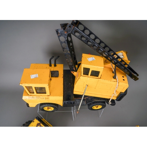 59 - Tonka Toys.  Four large scale vehicles - car carrier, loader, 4 wheel crane, dump truck, all requiri... 