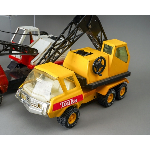 62 - Tonka Toys.  A collection of medium scale 6 wheel crane trucks, 4 red and 2 yellow AF (6)