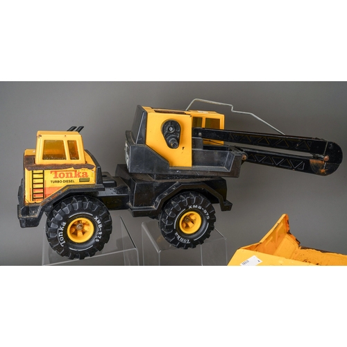 74 - Tonka Toys.  A collection of 4 large scale vehicles, 2 x dumper truck, 4 wheel crane truck and track... 