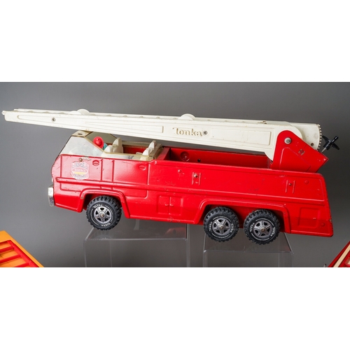 76 - Tonka Toys.  Large scale 6 wheel fire engine, 3 different variations of trim (3)