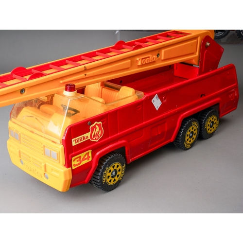 76 - Tonka Toys.  Large scale 6 wheel fire engine, 3 different variations of trim (3)