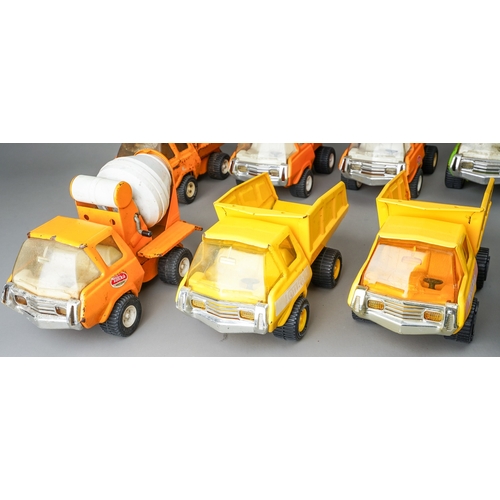 78 - Tonka Toys.  A mixed groups of 12 medium size 4 wheel trucks, different bodies and colours.  Mainly ... 