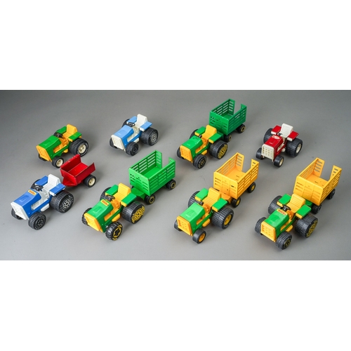 82 - Tonka Toys.  A quantity of small scale tractors and trailers