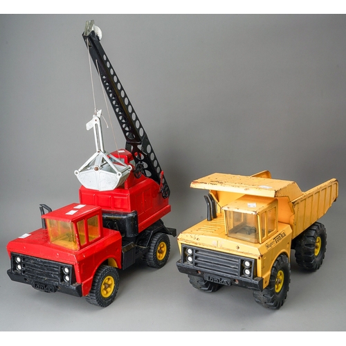 92 - Tonka Toys.  Large scale dumper truck and a 4 wheel crane truck in red with grab bucket (2)